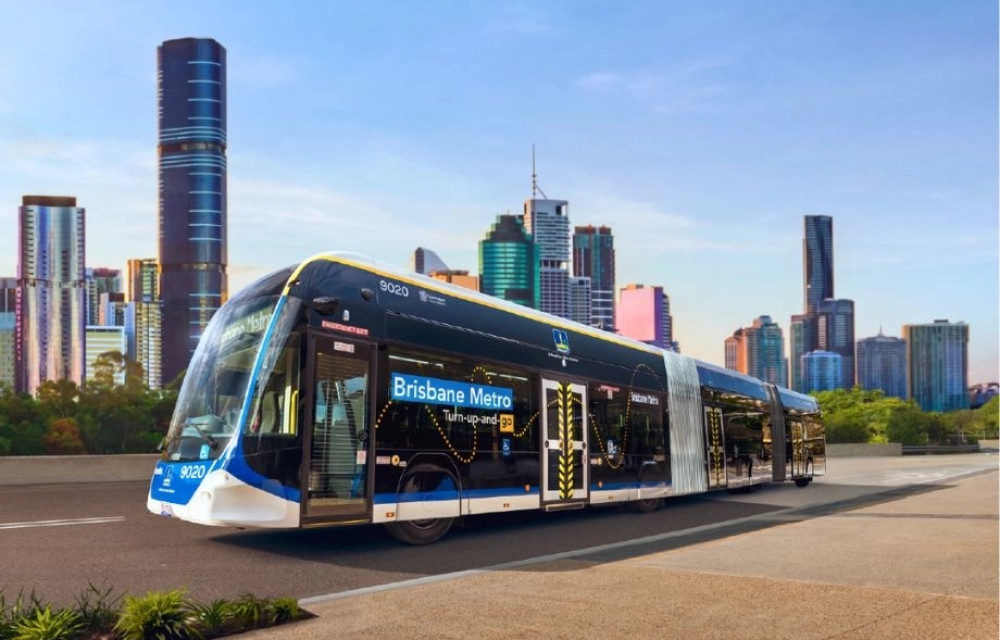 Brisbane Metro electric bus on dedicated track showing proposed expansion routes.