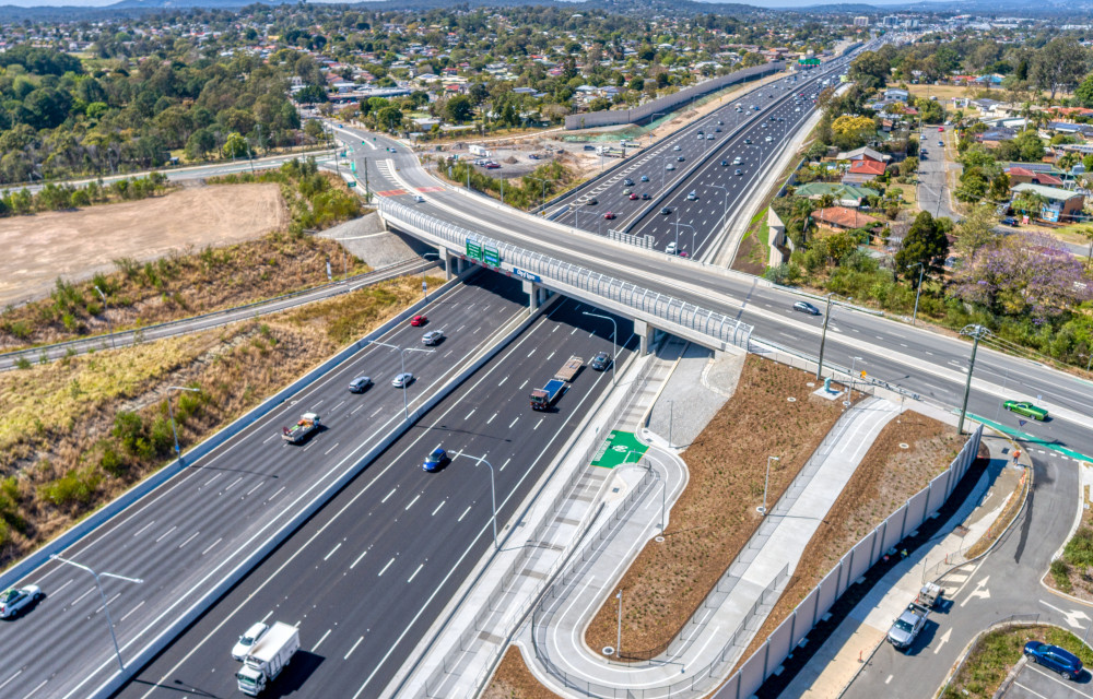 Artist impression of planned road safety upgrade works on a regional Queensland highway showing widened lanes and new signage.